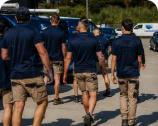 Plumbers walking to their service vans on a Enfield job